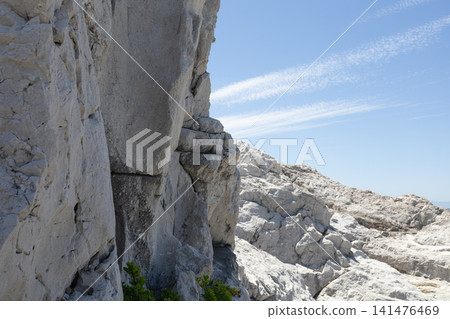 The white limestone rocks of Shirasaki Coast stand out against the blue sky. The white limestone rocks of Shirasaki Coast stand out against the blue sky. 141476469