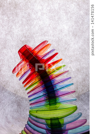 Still life with colorful glass coasters on a gray background Still life with colorful glass coasters on a gray background 141478156