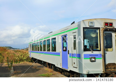 Departing from Yamazaki Station on the Hakodate Main Line in Hokkaido. Departing from Yamazaki Station on the Hakodate Main Line in Hokkaido. 141478180