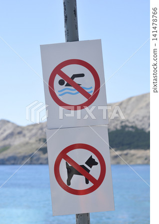 No swimming and no dogs signs at the beach No swimming and no dogs signs at the beach 141478766