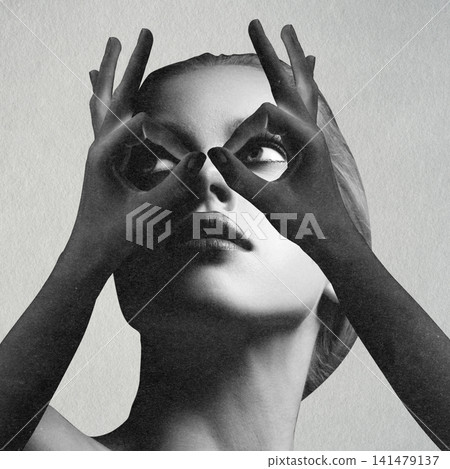 Woman framing eyes with hands searching for vision Woman framing eyes with hands searching for vision 141479137
