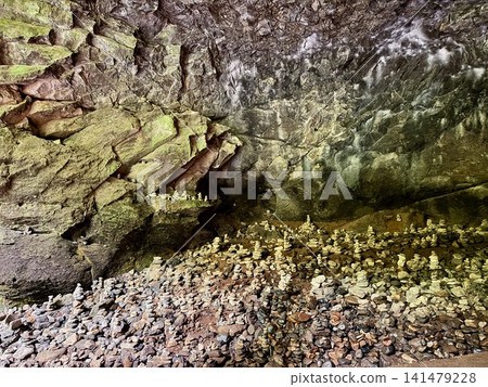 A landscape of piled stones and torii gates spread across Amanoyasugawara in Takachiho Town, Miyazaki Prefecture. A landscape of piled stones and torii gates spread across Amanoyasugawara in Takachiho Town, Miyazaki Prefecture. 141479228