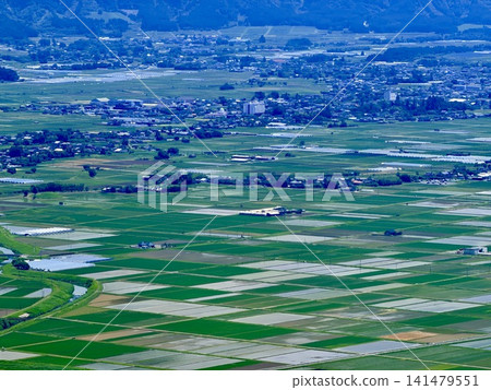 A view of the vast Aso Caldera and rural landscape from the outer rim of the Aso-Kuju National Park in Kumamoto Prefecture. 141479551