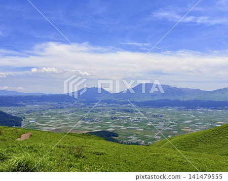 A view of the vast Aso Caldera and rural landscape from the outer rim of the Aso-Kuju National Park in Kumamoto Prefecture. 141479555