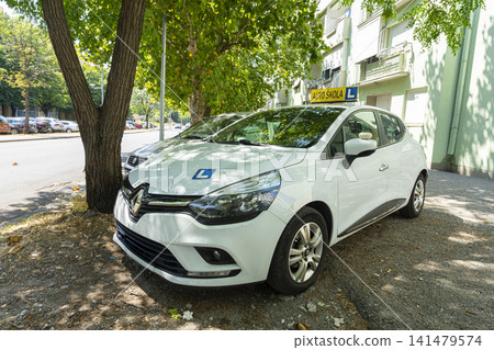 a driving school car parked in Podgorica, Montenegro a driving school car parked in Podgorica, Montenegro 141479574