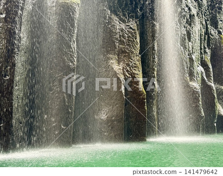 The Manai Falls and the magnificent columnar jointed gorge scenery can be seen in Takachiho Gorge in Takachiho Town, Miyazaki Prefecture. The Manai Falls and the magnificent columnar jointed gorge scenery can be seen in Takachiho Gorge in Takachiho Town, Miyazaki Prefecture. 141479642