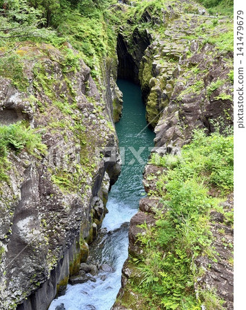 The Manai Falls and the magnificent columnar jointed gorge scenery can be seen in Takachiho Gorge in Takachiho Town, Miyazaki Prefecture. The Manai Falls and the magnificent columnar jointed gorge scenery can be seen in Takachiho Gorge in Takachiho Town, Miyazaki Prefecture. 141479679