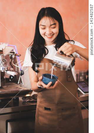 Young woman at barista school learning how to make espresso coffee. Young woman at barista school learning how to make espresso coffee. 141482587