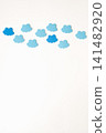 Border of blue clouds on a white background. The concept of cloudy, cloudy weather or mood. Copying space 141482920