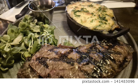 Grilled steak dinner with roasted vegetables Grilled steak dinner with roasted vegetables 141483096