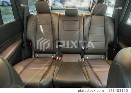 Empty rear car seats with leather upholstery Empty rear car seats with leather upholstery 141483130