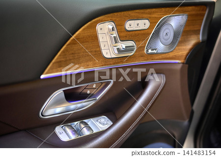 Luxury car interior door panel with seat controls Luxury car interior door panel with seat controls 141483154