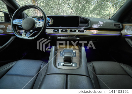 Luxury electric car interior with panoramic dashboard 141483161
