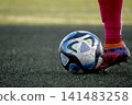 Soccer player who kicks the ball 141483258