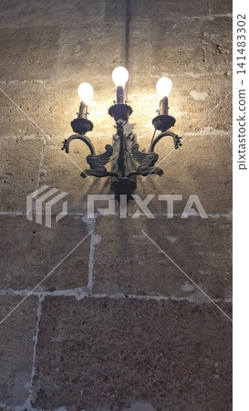 Vintage wall sconce with glowing light bulbs Vintage wall sconce with glowing light bulbs 141483302