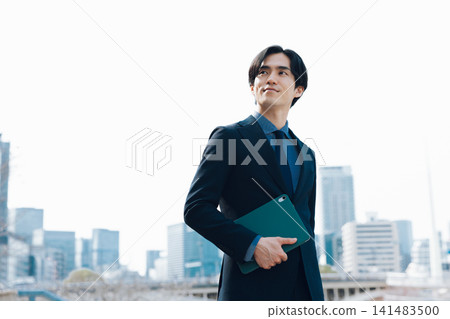 A businessman with a tablet A businessman with a tablet 141483500