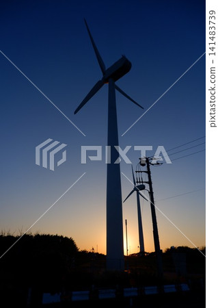 A romantic landscape with a sky and windmills A romantic landscape with a sky and windmills 141483739