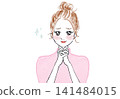 A woman with her hands clasped together, tears welling up in her eyes. 141484015