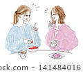 Two stylish women with cheerful smiles engaging in conversation. 141484016
