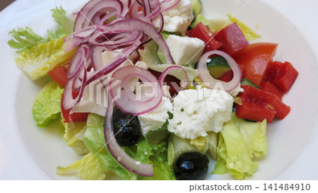 Close View of a Fresh Greek Salad in a White Bowl Close View of a Fresh Greek Salad in a White Bowl 141484910