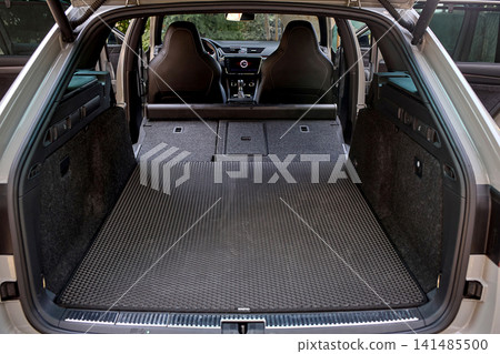 Spacious luxury car trunk with folded rear seats Spacious luxury car trunk with folded rear seats 141485500