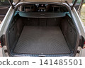 Open car trunk with protective cargo mat 141485501