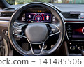 Modern car interior with digital dashboard and steering wheel 141485506