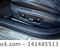 Luxury car seat adjustment controls close up 141485513