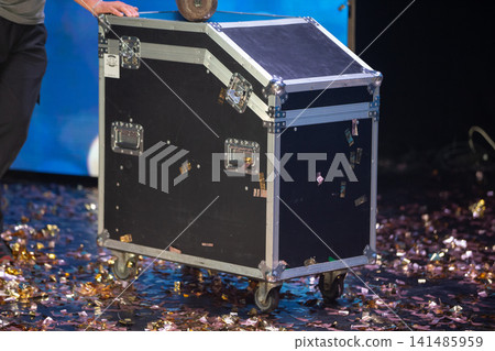 Stage prop box with confetti on the ground after a lively performance at a theater event Stage prop box with confetti on the ground after a lively performance at a theater event 141485959
