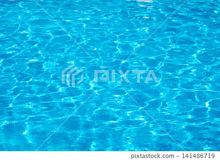 Blue pool water with sun reflections Blue pool water with sun reflections 141486719