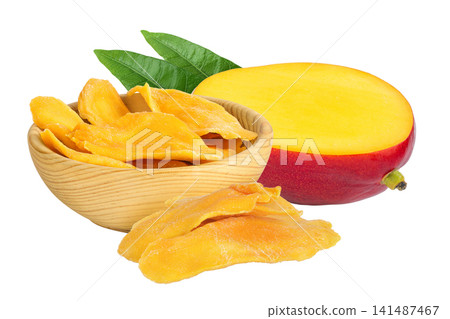 dried mango in wooden bowl isolated on white background dried mango in wooden bowl isolated on white background 141487467