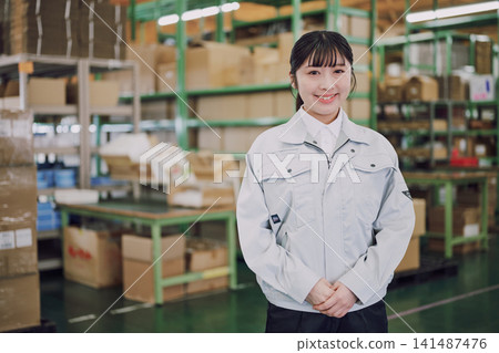 Portrait of a woman working in a warehouse Portrait of a woman working in a warehouse 141487476