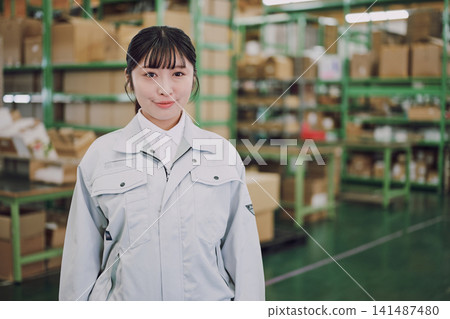 Portrait of a woman working in a warehouse Portrait of a woman working in a warehouse 141487480