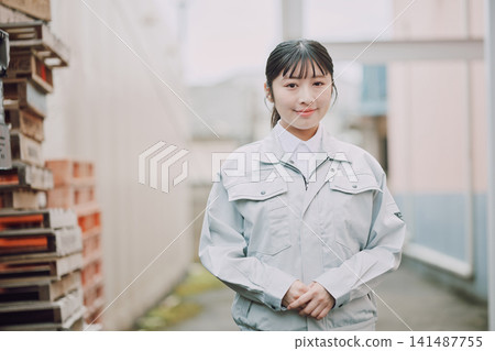 Portrait of a woman in work clothes Portrait of a woman in work clothes 141487755