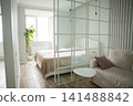 Modern bedroom with elegant divider and minimalist decor in a vacation rental. Interior design real estate and home staging concepts 141488842