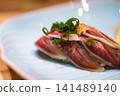 Seared Wagyu beef nigiri with grated daikon radish and green onions 141489140