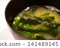 Miso soup with seaweed and green onions 141489145