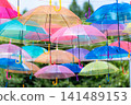 Sky art featuring rows of transparent umbrellas 141489153