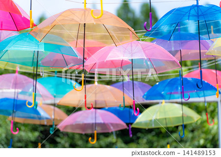 Sky art featuring rows of transparent umbrellas Sky art featuring rows of transparent umbrellas 141489153
