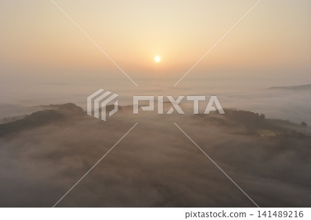 A sea of clouds at sunrise over the mountains of Jilin Province A sea of clouds at sunrise over the mountains of Jilin Province 141489216