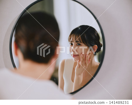 A young woman doing skin care A young woman doing skin care 141489231