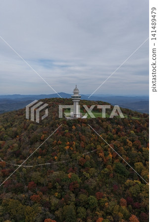 Aerial view of the autumn mountains and pagoda in Longwan, Jilin. 141489479