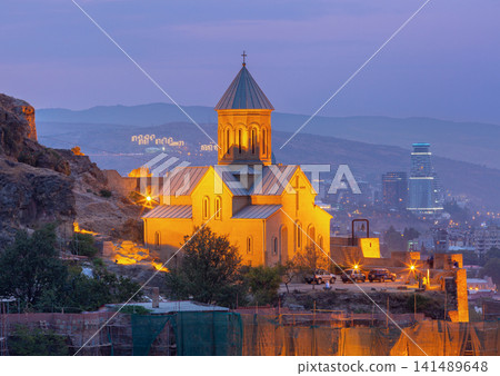 Illuminated Saint Nicholas Church and Narikala Fortress at dusk in Tbilisi, Georgia Illuminated Saint Nicholas Church and Narikala Fortress at dusk in Tbilisi, Georgia 141489648