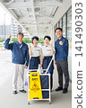 Four men and women who are staff members for building cleaning and facility maintenance. 141490303