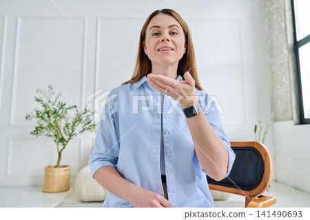 Young woman during a video call. Virtual Connection concept Young woman during a video call. Virtual Connection concept 141490693