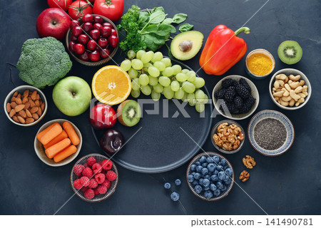 Healthy antioxidant rich foods flat lay on dark background with copy space Healthy antioxidant rich foods flat lay on dark background with copy space 141490781