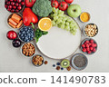 Healthy antioxidant rich foods flat lay on light background with copy space 141490783