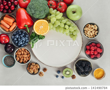 Healthy antioxidant rich foods flat lay on light background with copy space Healthy antioxidant rich foods flat lay on light background with copy space 141490784