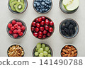 Healthy antioxidant rich fruits, berries and nuts on light background 141490788