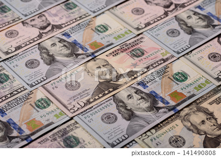 Paper US dollar bills of various denominations and cent coins as a business tool. Cash US dollars Paper US dollar bills of various denominations and cent coins as a business tool. Cash US dollars 141490808
